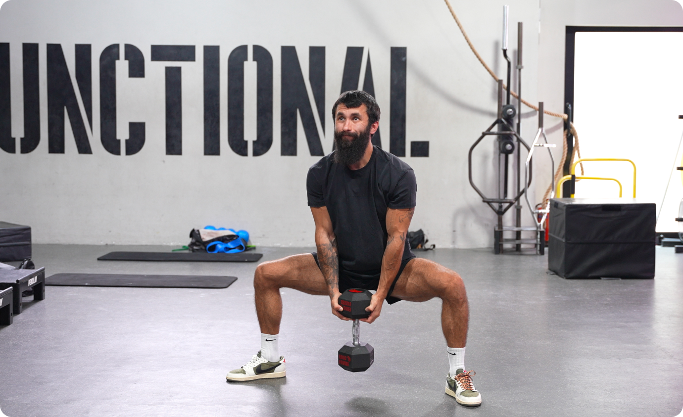Sumo squat with dumbbell